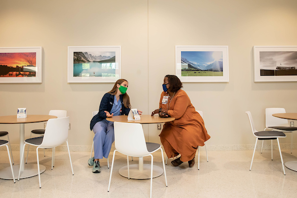 Dr. Loretta Jackson and medical student Mary "Alex" Fratesi chat together in the School of Medicine.